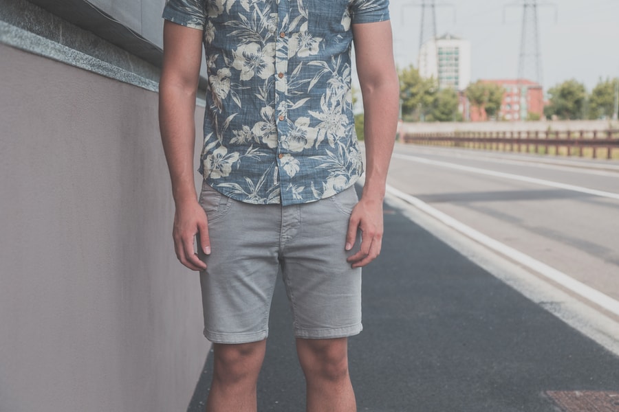 Detail Of A Young Handsome Man Wearing Shorts And Posing In An Urban Context
