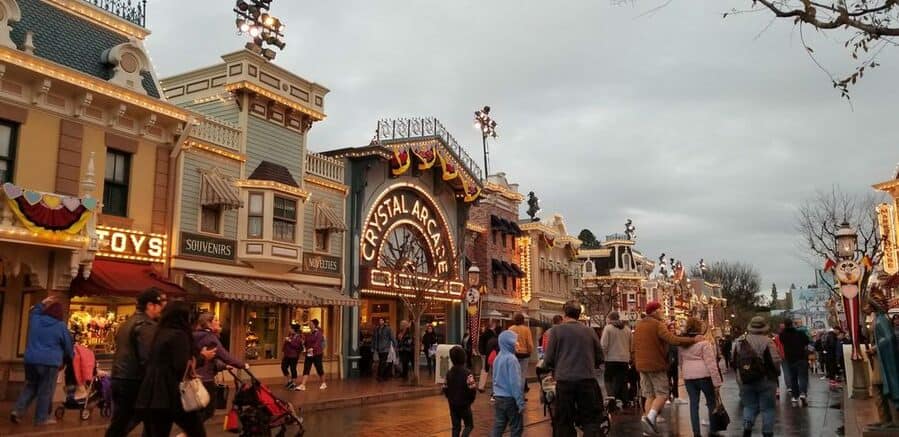 Disneyland Resort Area With People Walking On The Streets