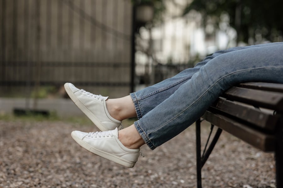 Female Legs In Comfort Casual Urban Sneakers.