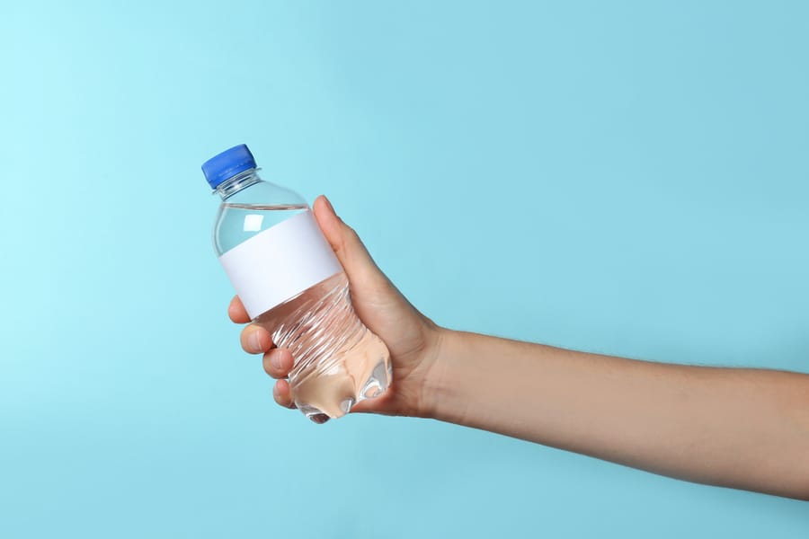 Woman Holding Plastic Bottle Pure