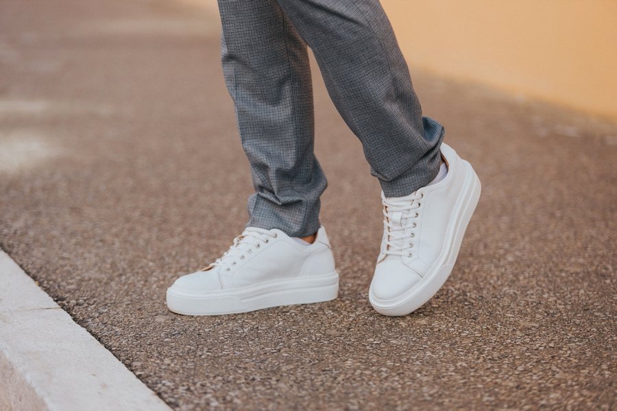 A Man Wearing White Sneakers
