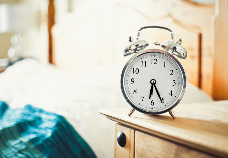 Alarm Clock On A Bedside Table