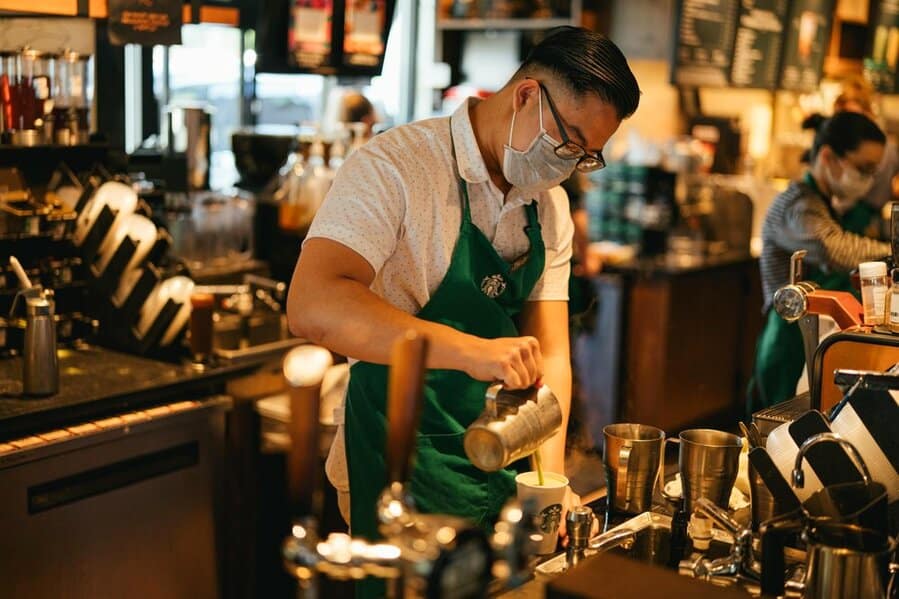 Barista Preparing Coffee At Starbucks