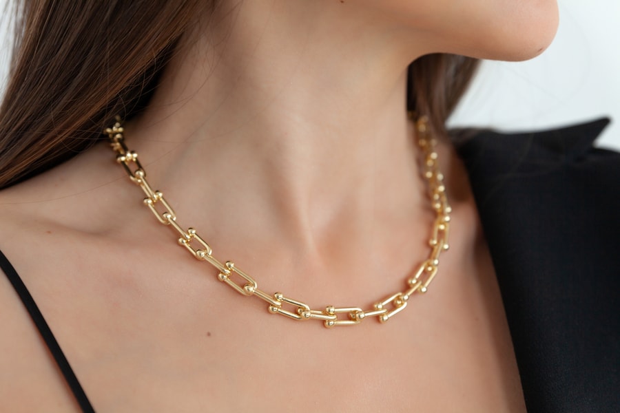 Woman Wearing Gold Necklace