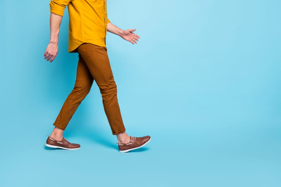 Cropped Photo Of Man Going Towards Empty Space In Brown Shoes Trousers Pants Trendy Trend Stylish Isolated Over Blue Pastel Color Background