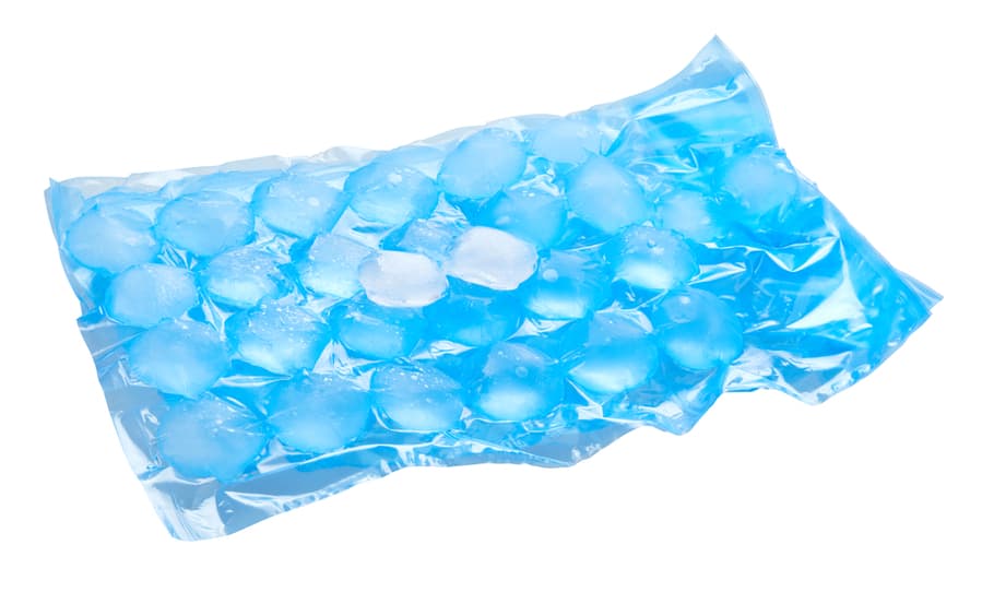 Ice Cubes In Plastic Bag, Freezer For Ice Circle Cubes Isolated On White With Clipping Path