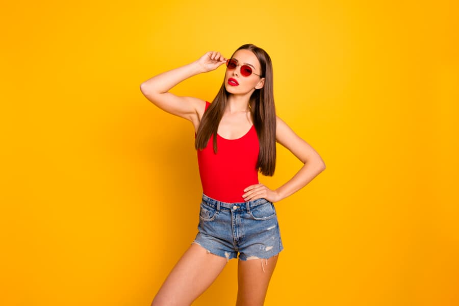 Close Up Photo Of Amazing Lady Colorful Appearance Luxury Vogue Wear Specs Jeans Denim Shorts Red Body Tank-Top