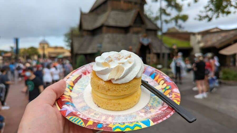Hand Holding Plate With A Pan Cake In Epcot