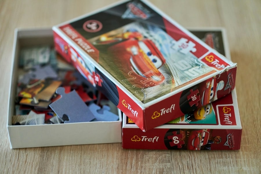 A Trefl Brand Disney Pixar Cars Puzzle In A Box On A Wooden Table