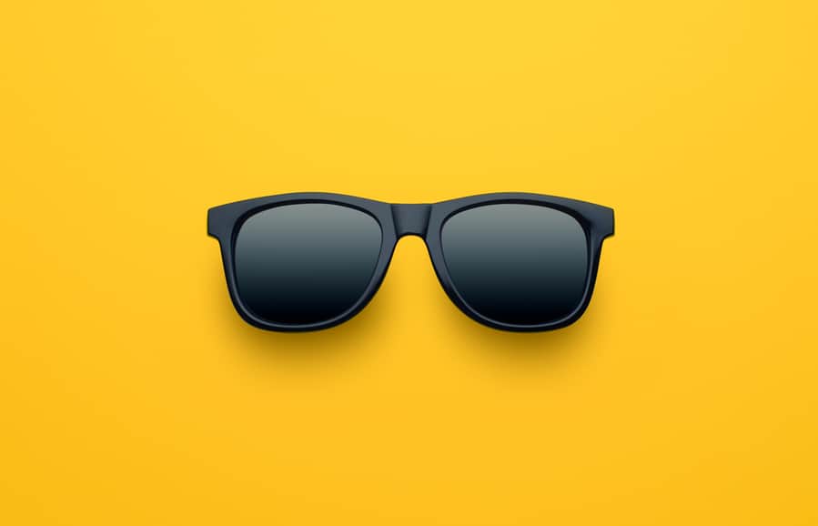 Black Sunglasses On Yellow Background
