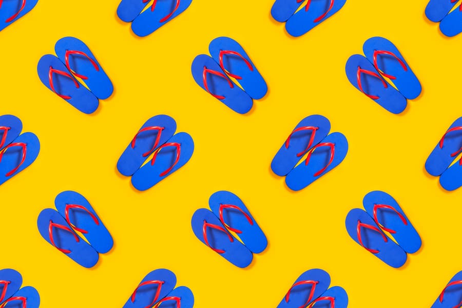 Blue Flip Flops On Yellow Background Seamless Pattern. Travel, Summer Vacation Minimalistic Concept