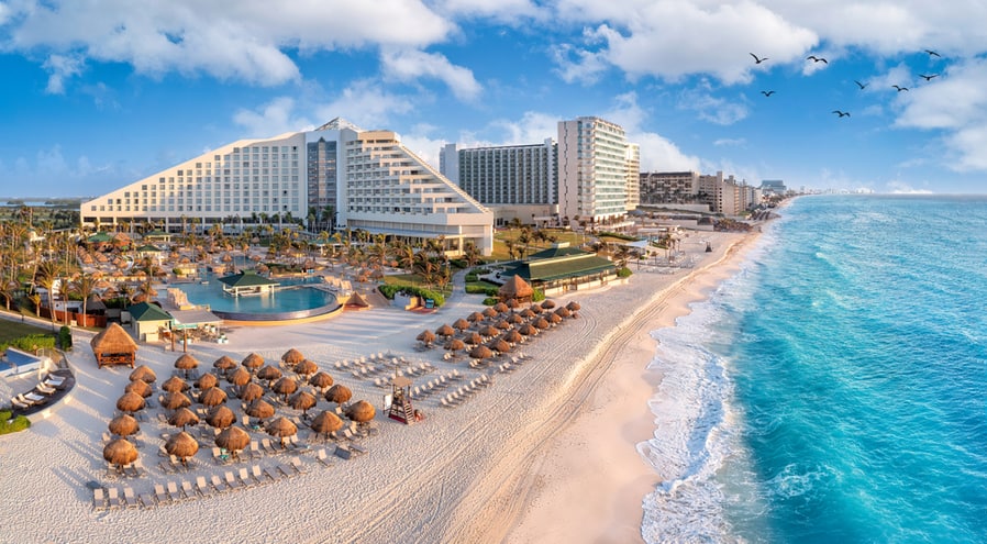Cancun Beach With Resorts Near Blue Ocean