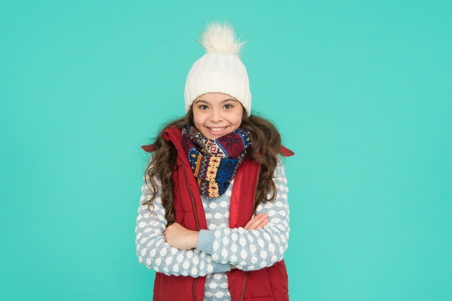Child With Long Curly Hair In Knitted Hat. Cold Season Style Christmas Activity.