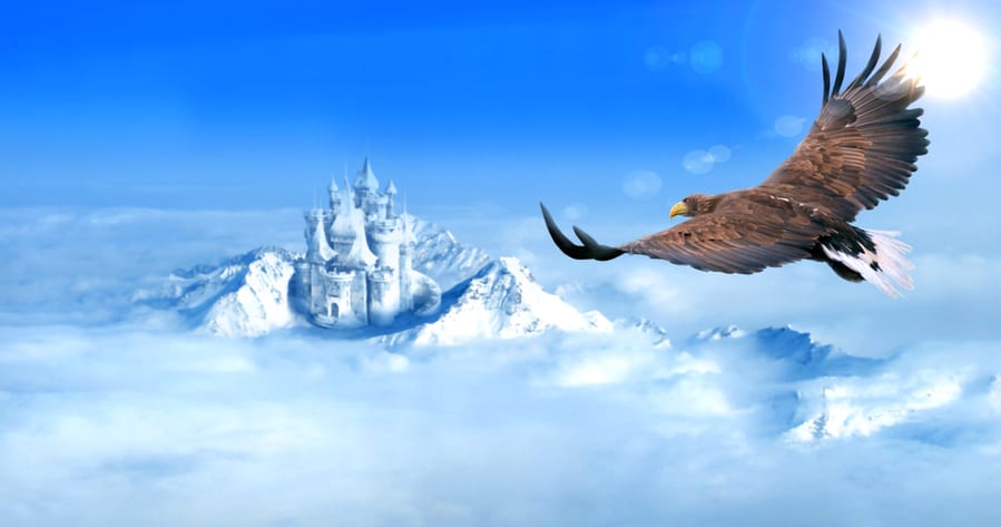 Eagle Flying Towards Ice Castle In Snow Mountains Aerial View