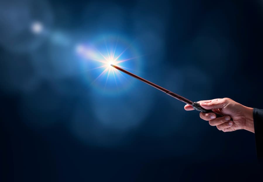 Magic Wand With Sparkle On Blue Background