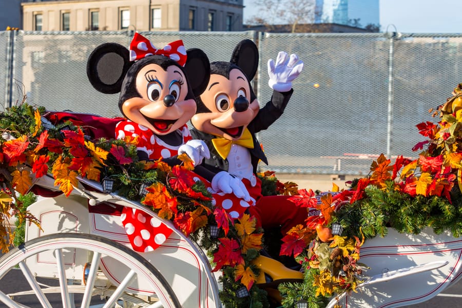 Mickey And Minnie Mouse Ride In An Open Carriage In The Annual Thanksgiving Day Parade