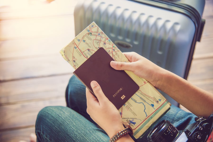 People Holding Passports, Map For Travel With Luggage For The Trip