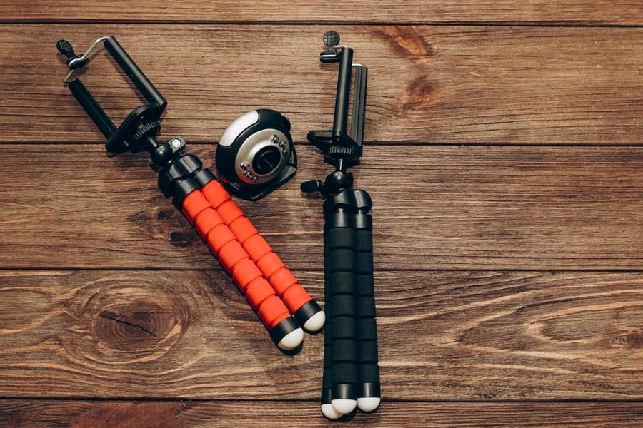 Two Manual Tripod Monopods For A Phone Or A Small Camera On A Wooden Table