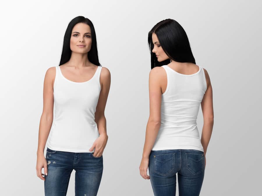 White Tank Top On A Young Woman In Jeans