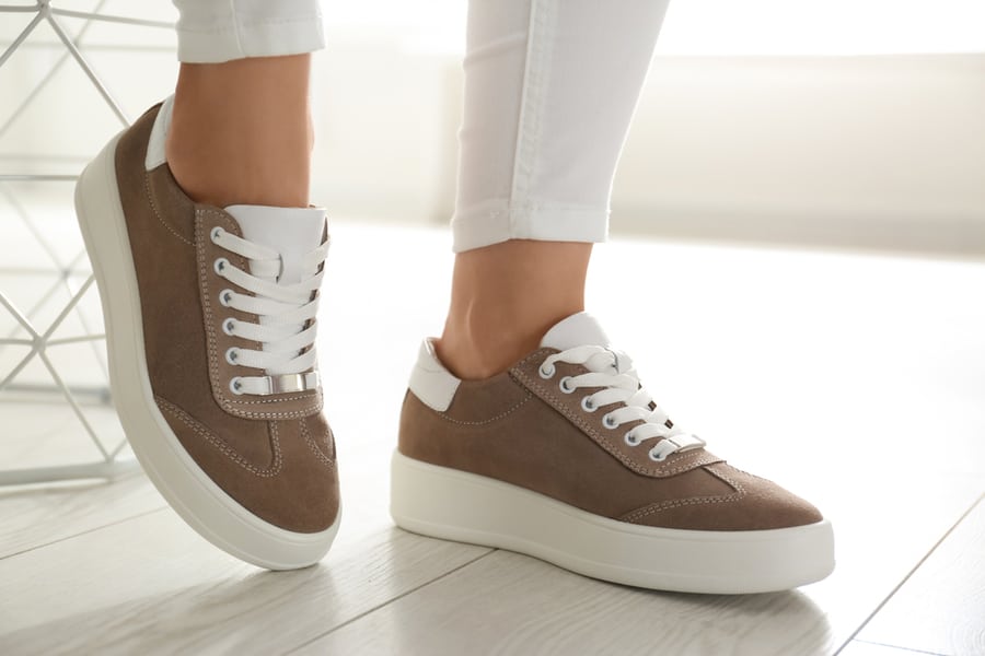 Woman Wearing Comfortable Stylish Shoes Indoors